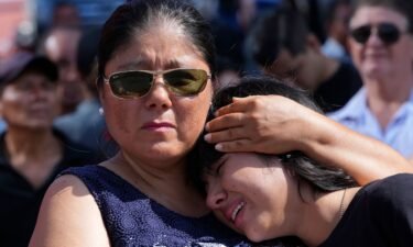 Mourners cry during the funeral of Agustin Intriago in Manta