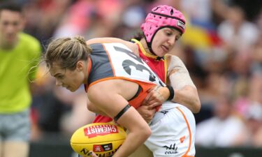 Heather Anderson wore a pink helmet so her vision-impaired mother could see her on the pitch.