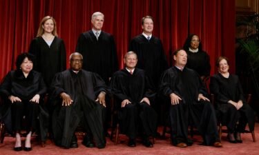 The Supreme Court justices pose for their group portrait at the Supreme Court in Washington