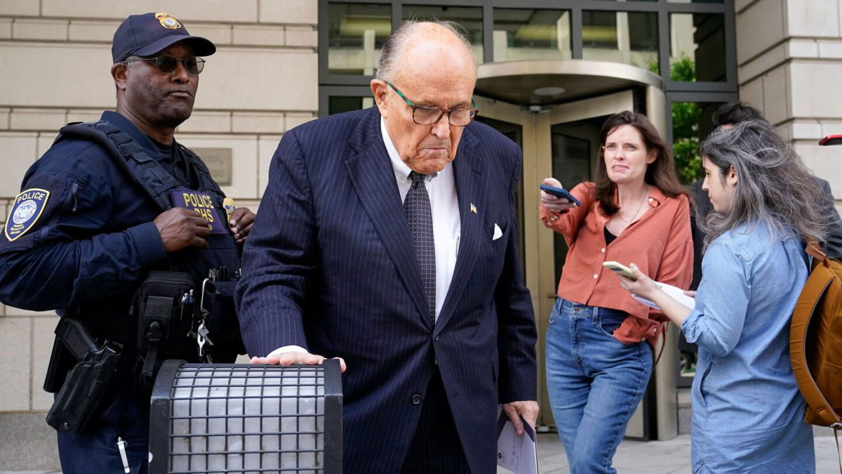 <i>Patrick Semansky/AP</i><br/>Former New York City Mayor Rudy Giuliani departs federal court on Friday