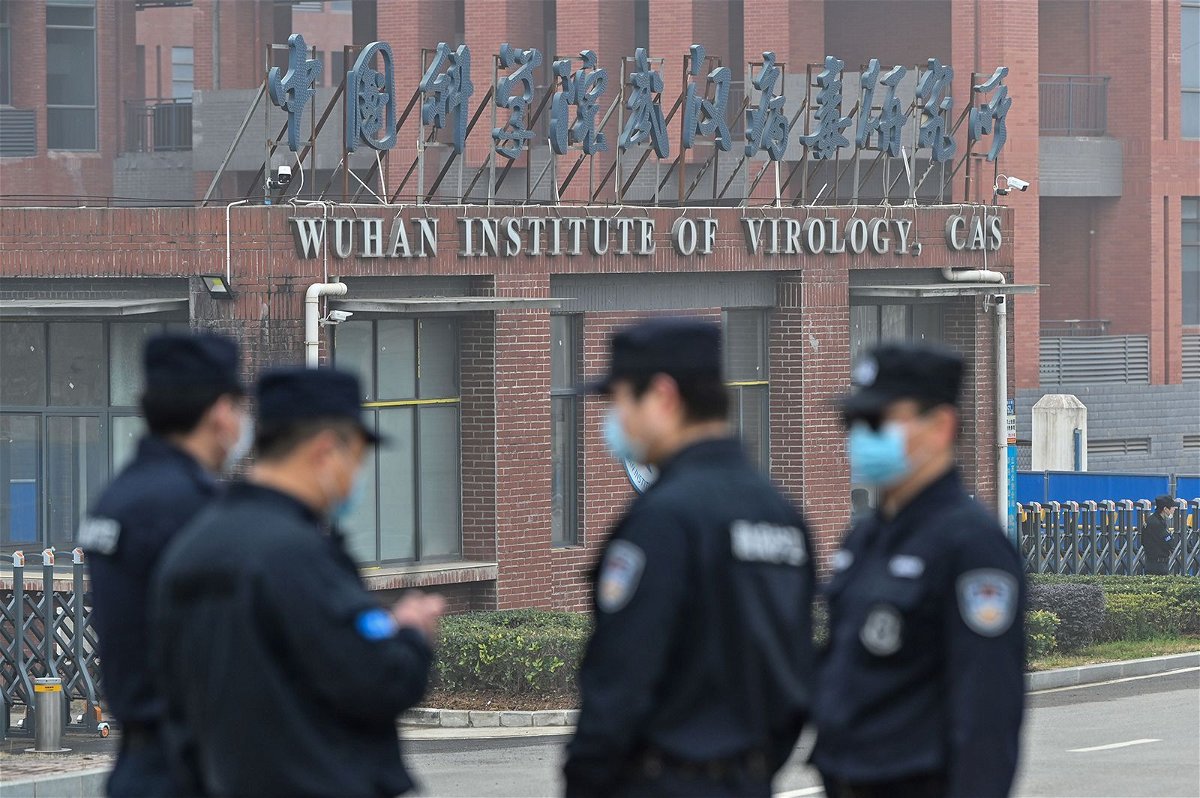 <i>Hector Retamal/AFP/Getty Images/File</i><br/>Security personnel stand guard outside the Wuhan Institute of Virology in Wuhan in February 3