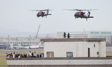 Black Hawk helicopters prepare to land at Taoyuan International Airport as part of the annual Han Kuang military exercise on July 26.