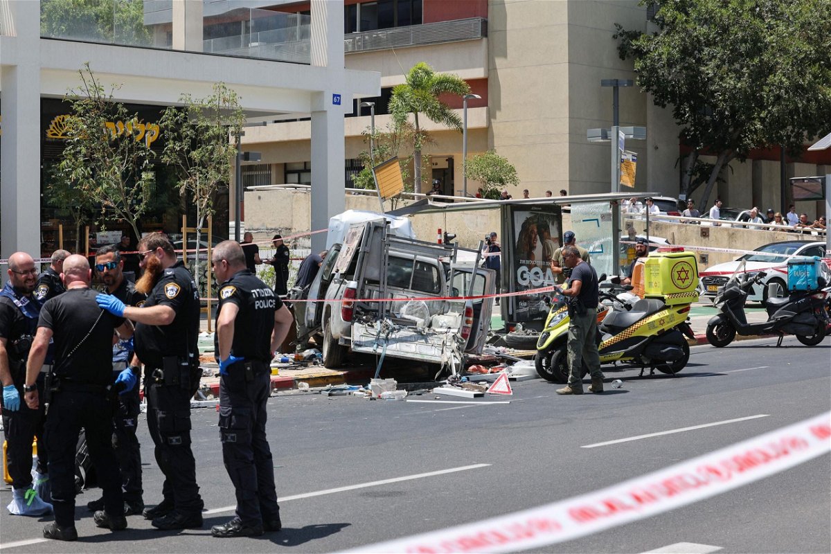 <i>Jack Guez/AFP/Getty Images</i><br/>Members of Israeli security and emergency personnel work at the site of the car ramming attack in Tel Aviv on July 4.