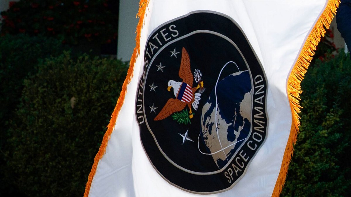 <i>Evan Vucci/AP</i><br/>The flag of the US Space Command is presented during a ceremony for the establishment of the command in the Rose Garden of the White House on August 29
