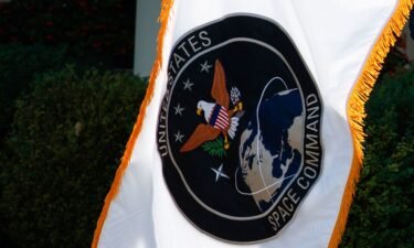 The flag of the US Space Command is presented during a ceremony for the establishment of the command in the Rose Garden of the White House on August 29