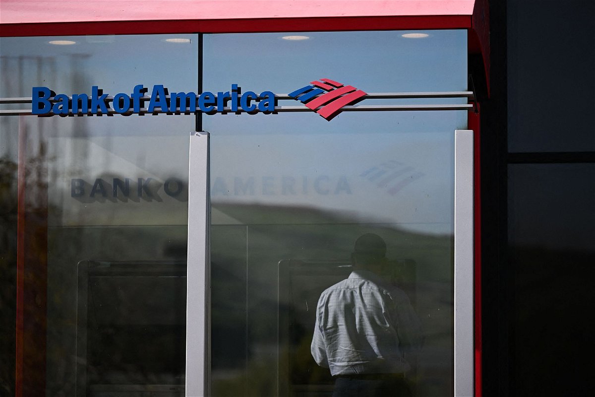 <i>Patrick T. Fallon/AFP/Getty Images</i><br/>A customer uses an ATM outside of a Bank of America branch.