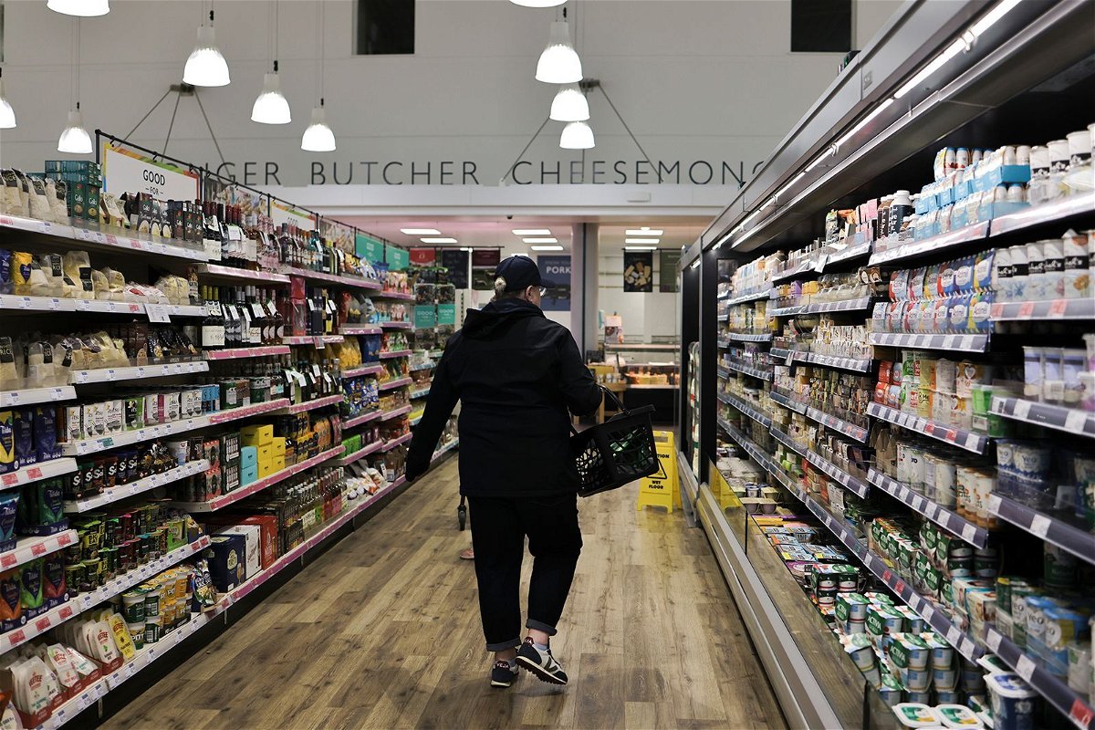 <i>Hesther Ng/SOPA Images/LightRocket/Getty Images</i><br/>A shopper seen walking between the aisles at a supermarket in Kendal