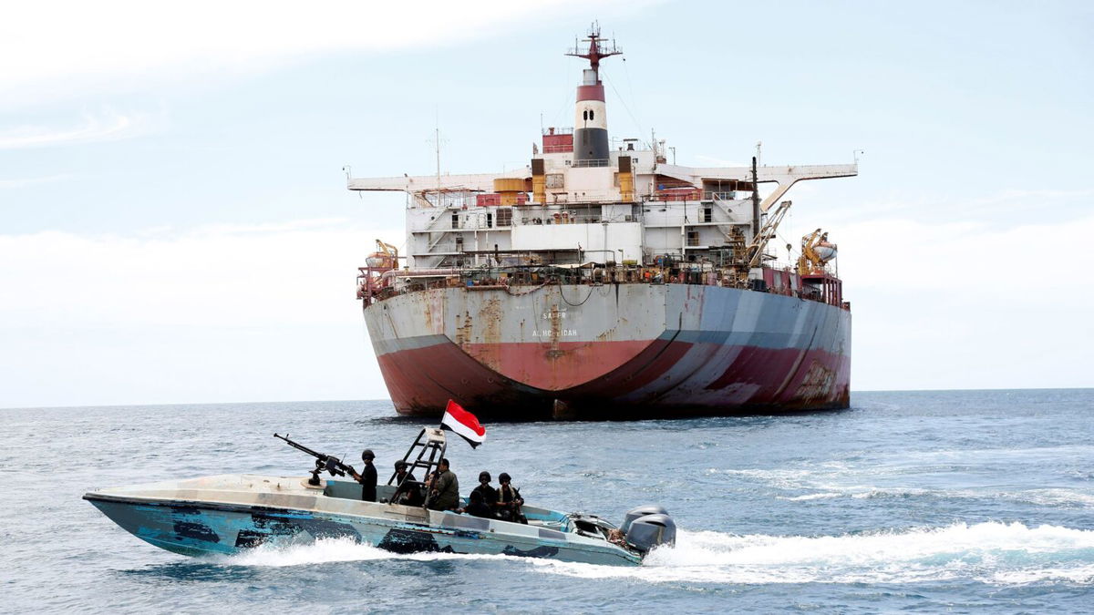 <i>Mohammed Mohammed/Xinhua via Getty Images/FILE</i><br/>A Yemeni coast guard boat sails past the FSO Safer vessel at Ras Issa port in Hodeidah province