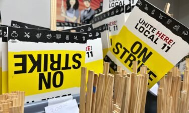 Picket signs are stacked in preparation for a strike Saturday morning at 65 major hotels in Los Angeles and Orange counties in Southern California.