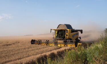 Harvester works on a wheat fields near ongoing Ukrainian counter-offensive in Prymorske