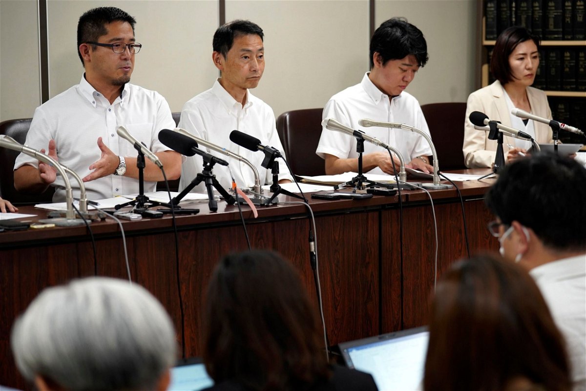 <i>Eugene Hoshiko/AP</i><br/>Lawyers speak during a news conference at Tokyo District Court on July 11