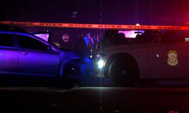 Investigators work at the scene of a shooting on July 3 at a block party in Indianapolis.