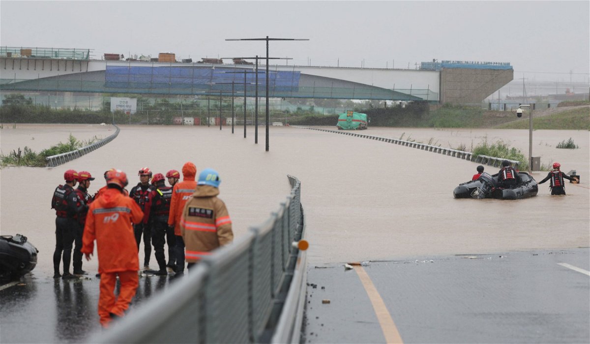 <i>Yonhap News Agency/Reuters</i><br/>Search and rescue operations near an underpass