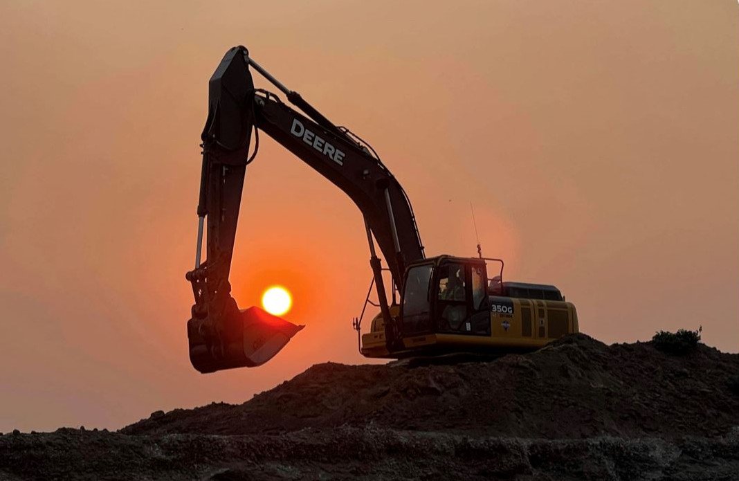 Backhoe seems to be helping a smoky sun rise Wednesday morning near Prineville