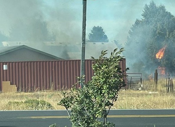 Fast-moving brush fire, as seen from Bear Creek and Rawhide roads, was very close to homes