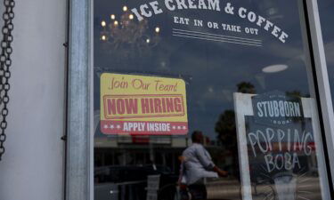 The US labor market is still hot. A 'Now Hiring' sign is posted outside of a restaurant on May 05