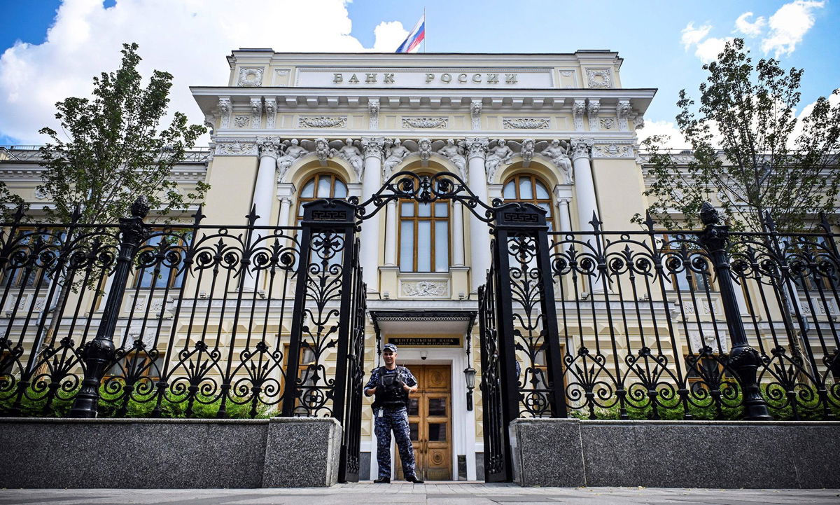 <i>Alexander Nemenov/AFP/Getty Images</i><br/>A police officer guards the entrance of the Russian Central Bank headquarters in downtown Moscow on July 21.