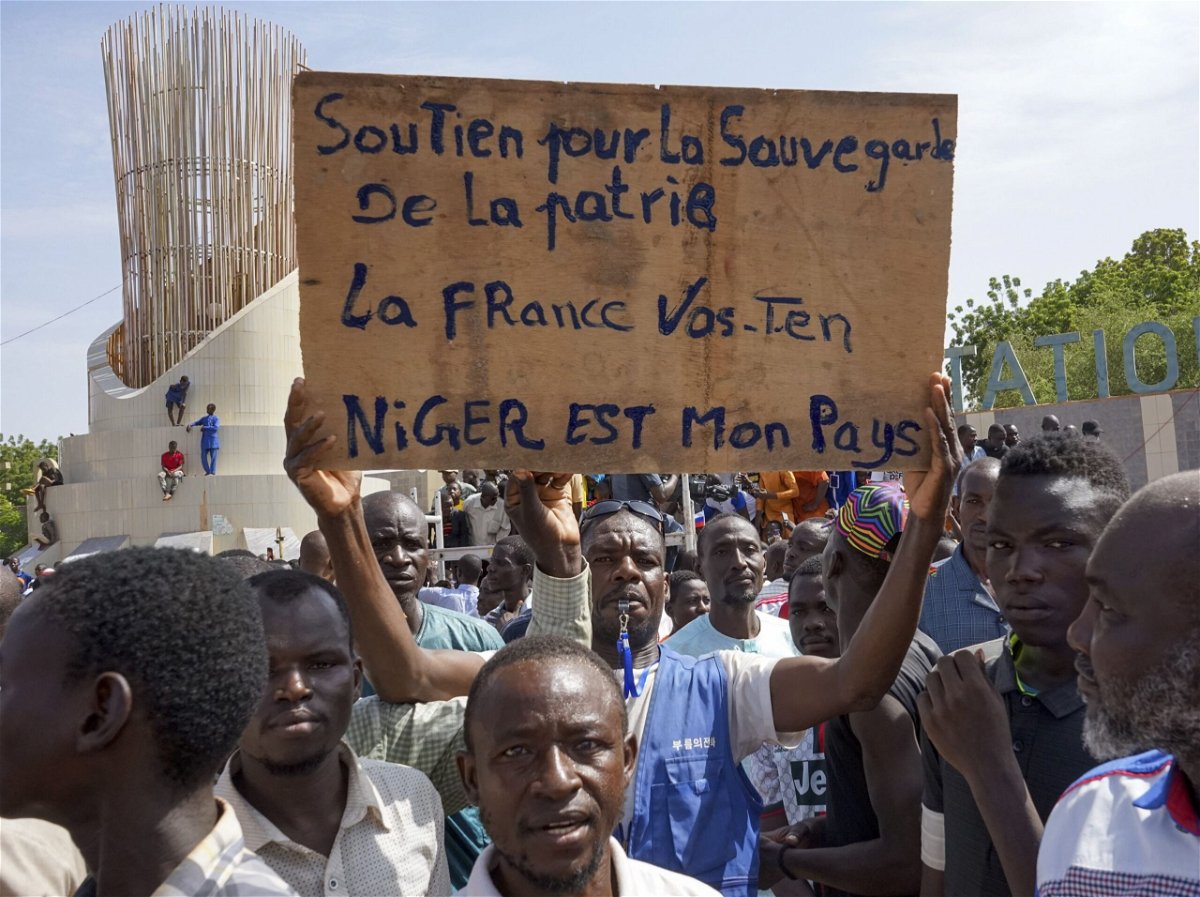 <i>Issifou Djibo/EPA-EFE/Shutterstock</i><br/>Protesters with a placard 'France go away