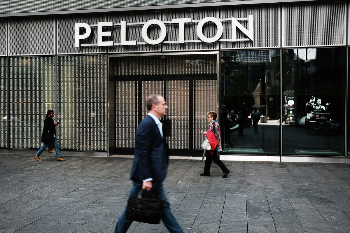 <i>Spencer Platt/Getty Images</i><br/>People walk by Peloton Studios on May 12