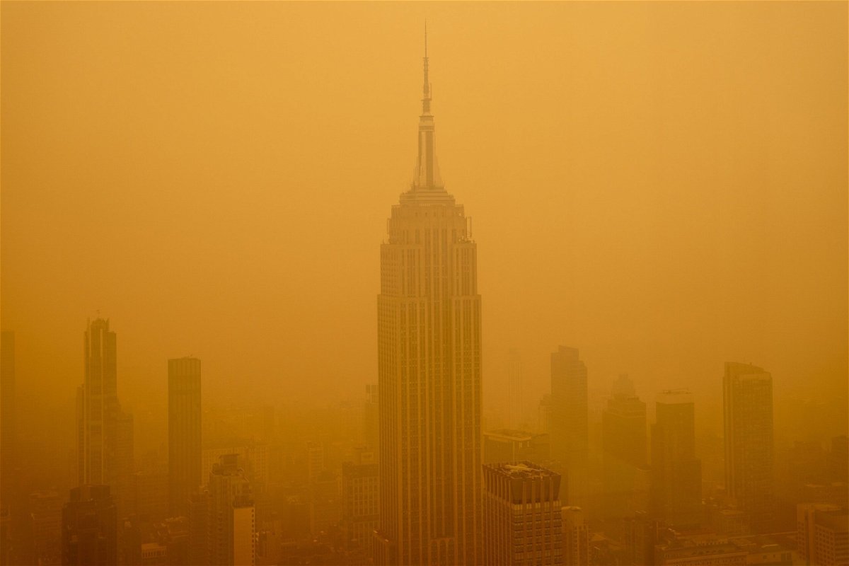 <i>David Dee Delgado/Getty Images</i><br/>Smoky haze from wildfires in Canada diminishes the visibility of the Empire State Building on June 7 in New York City. Wildfires in Canada that caused smoke to blanket parts of the United States in recent months were linked to a significant rise in emergency hospital visits related to asthma.