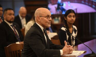 This picture shows Illinois Senator Dave Koehler with teenager Shreya Nallamothu