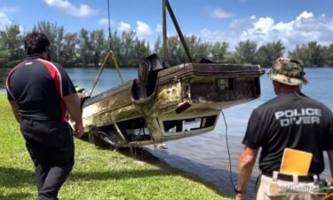 Divers were working Tuesday to recover vehicles from a lake in Doral