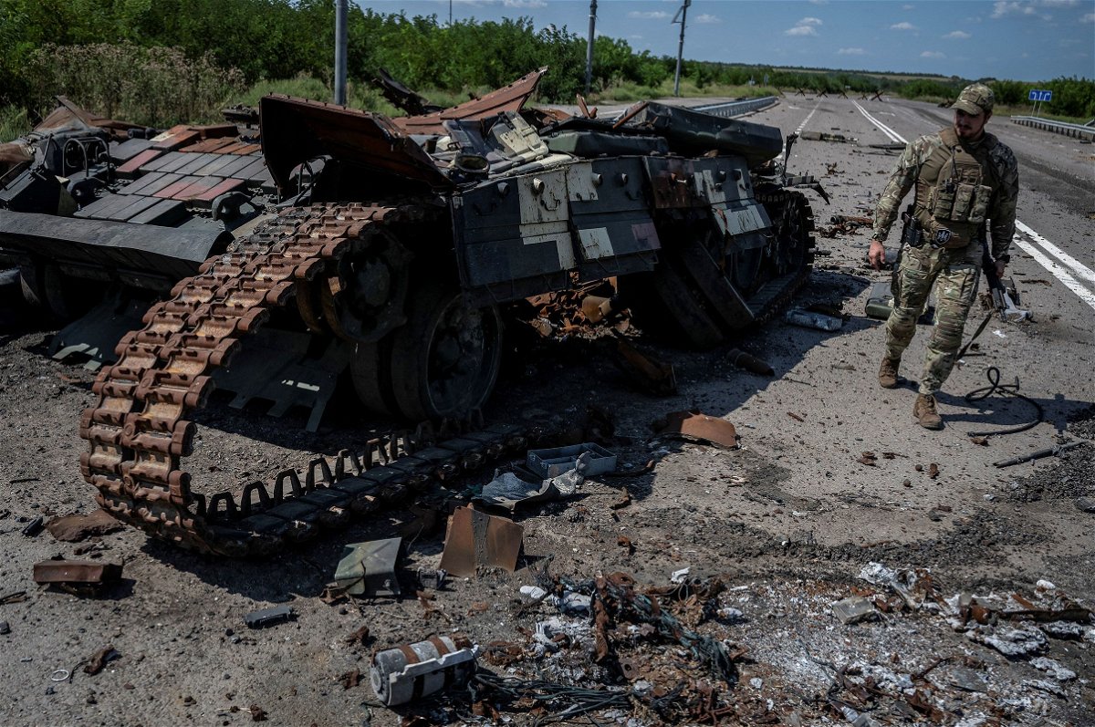 <i>Viacheslav Ratynskyi/Reuters</i><br/>Ukrainian soldiers ride a tank near Robotyne