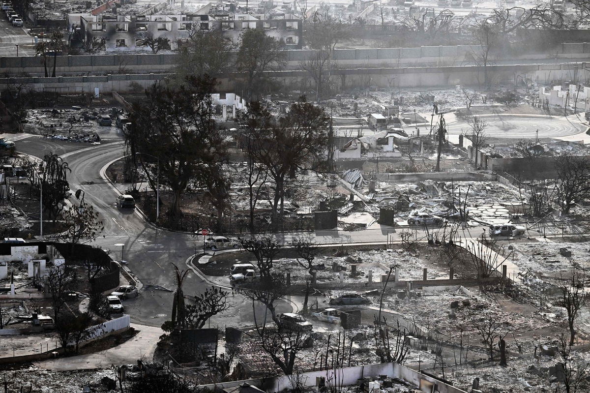 <i>Patrick T. Fallon/AFP/Getty Images</i><br/>An aerial image taken shows destroyed homes and buildings burned to the ground in Lahaina in the aftermath of wildfires in western Maui