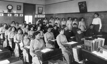 Fourth-grade students sit in a classroom at the former Genoa Indian Industrial School in Genoa