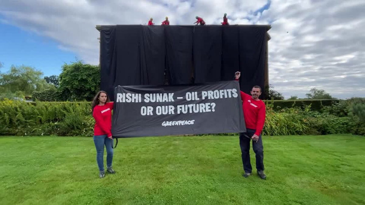 <i>Greenpeace/Reuters</i><br/>Greenpeace activists hung a black cloth over British Prime Minister Rishi Sunak's private mansion in northern England on Thursday