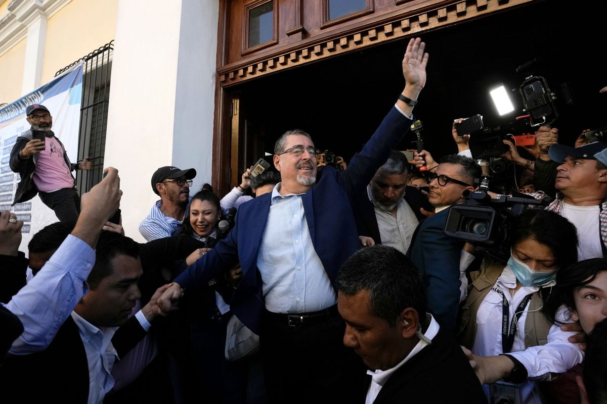 <i>Moises Castillo/AP</i><br/>Presidential candidate Bernardo Arévalo waves after voting in Guatemala City