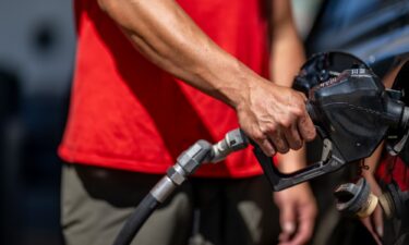 A person pumps gas at a Shell gas station on August 3 in Austin