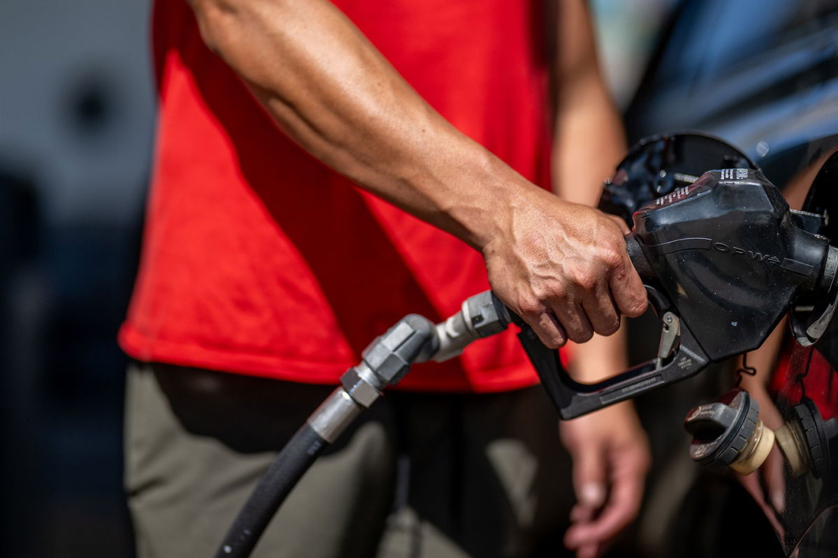 <i>Brandon Bell/Getty Images</i><br/>A person pumps gas at a Shell gas station on August 3 in Austin