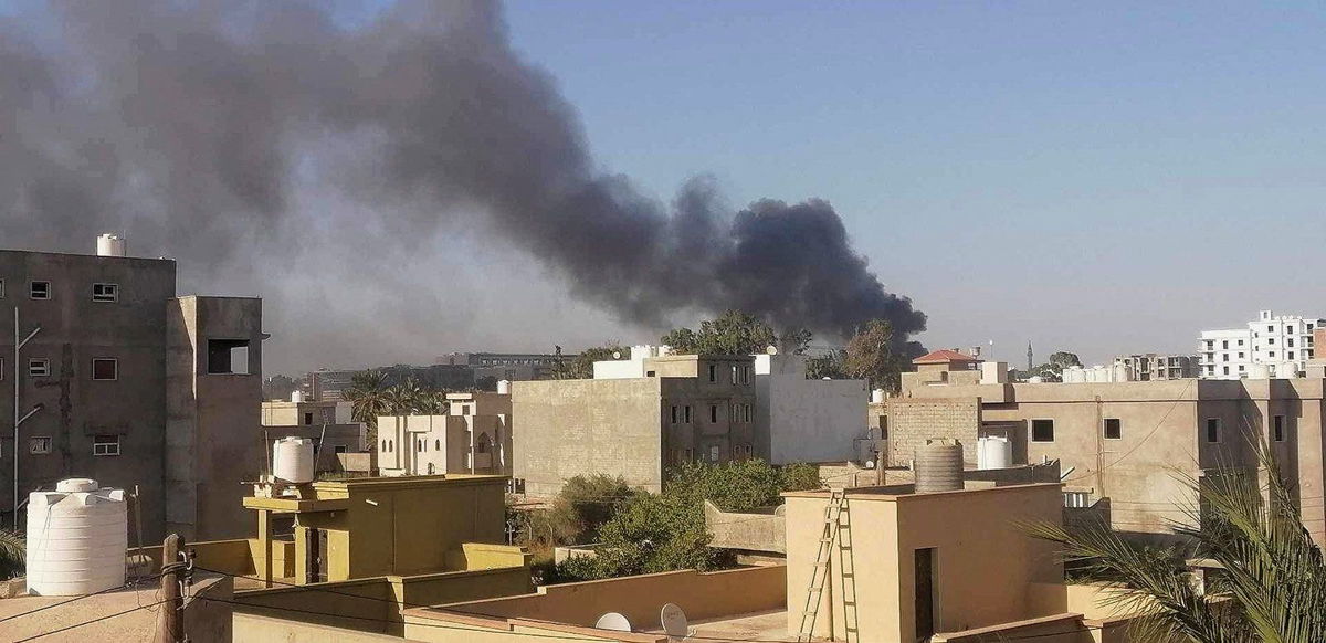 <i>Stringer/Reuters</i><br/>Smoke rises amid clashes between armed factions in Tripoli