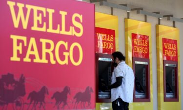 Wells Fargo customers use the ATM at a bank branch on August 8 in San Bruno