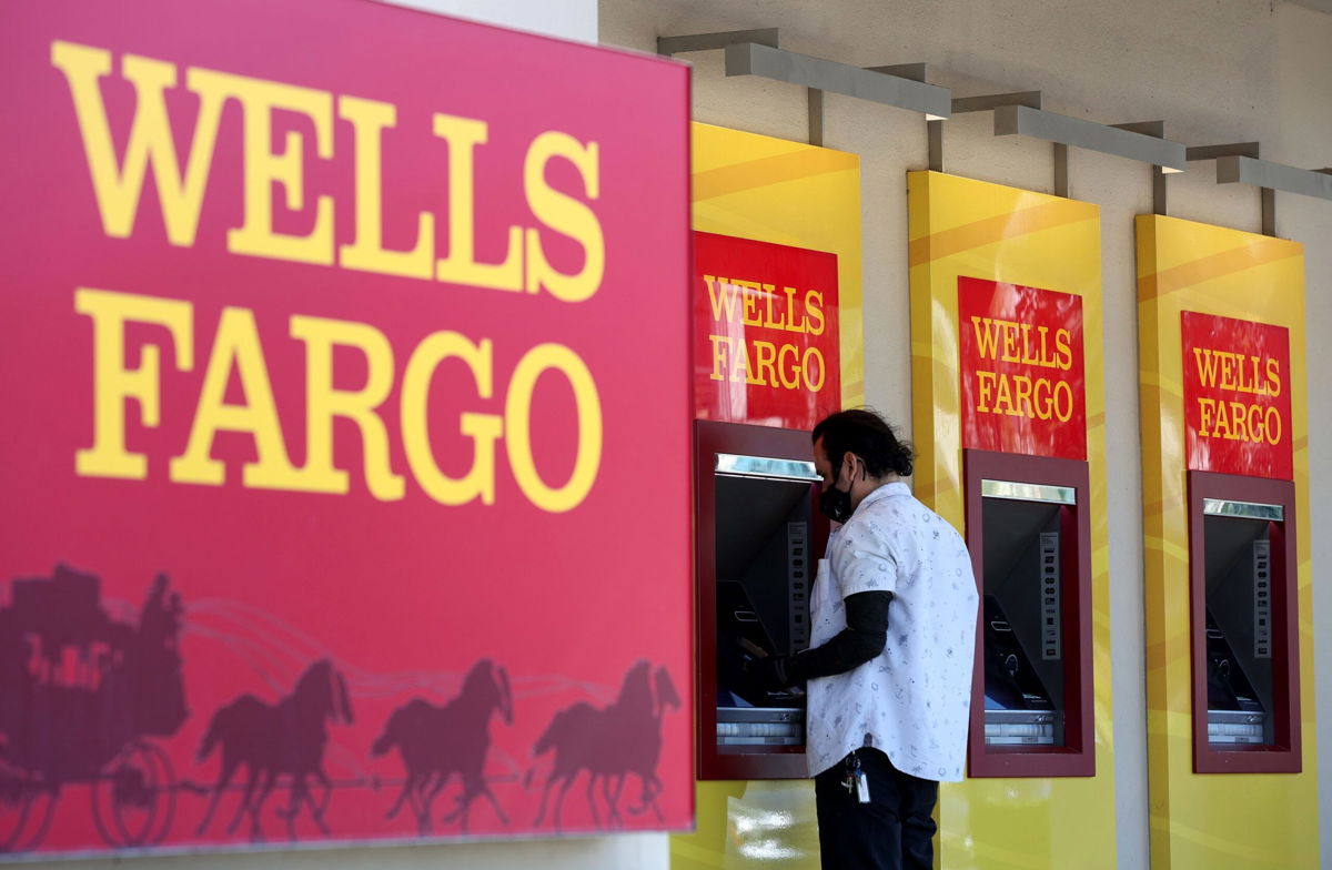 <i>Justin Sullivan/Getty Images</i><br/>Wells Fargo customers use the ATM at a bank branch on August 8 in San Bruno