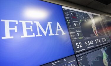 Screens display information on Hurricane Ian inside the National Response Coordination Center at FEMA headquarters in September 2022.