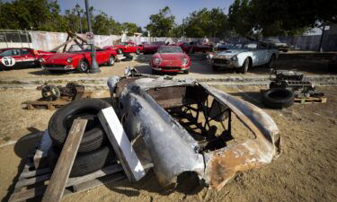 The 1945 Ferrari 500 Mondial Spider exhibited in a faux junkyard setting ahead of RM Sotheby's Monterey auction..