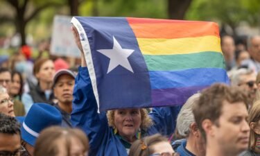 Supporters of trans rights rally on the steps of the Texas Capitol on March 20.  A judge in Texas has blocked for now a new law that prohibits gender-affirming care for most minors in the state.