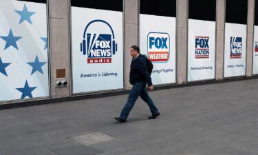 People walk by the News Corporation headquarters