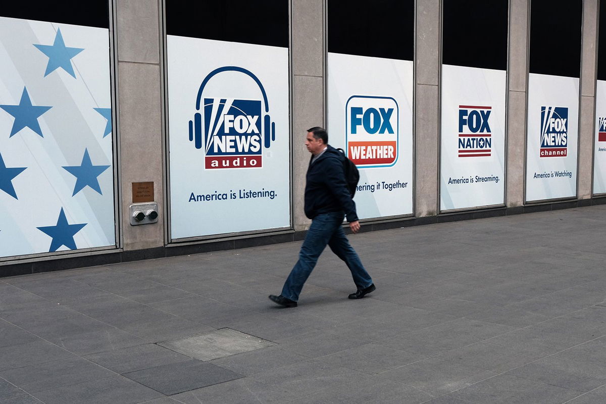 <i>Spencer Platt/Getty Images/File</i><br/>People walk by the News Corporation headquarters