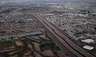 This aerial image from May 12 shows a border wall and concertina wire barriers standing along the Rio Grande between El Paso