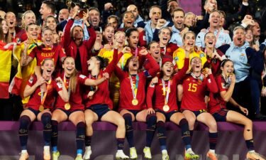 Spain's team celebrate with the trophy after winning the final of the Women's World Cup.
