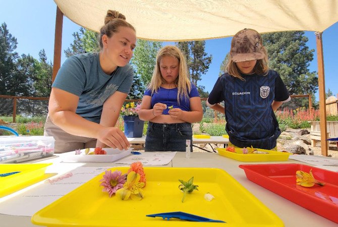 At ExplOregon: Project Good Earth, kids build connections to the outdoors, each other and themselves. Pictured here, Think Wild works with Project Good Earth youth to build understanding and appreciation for nature