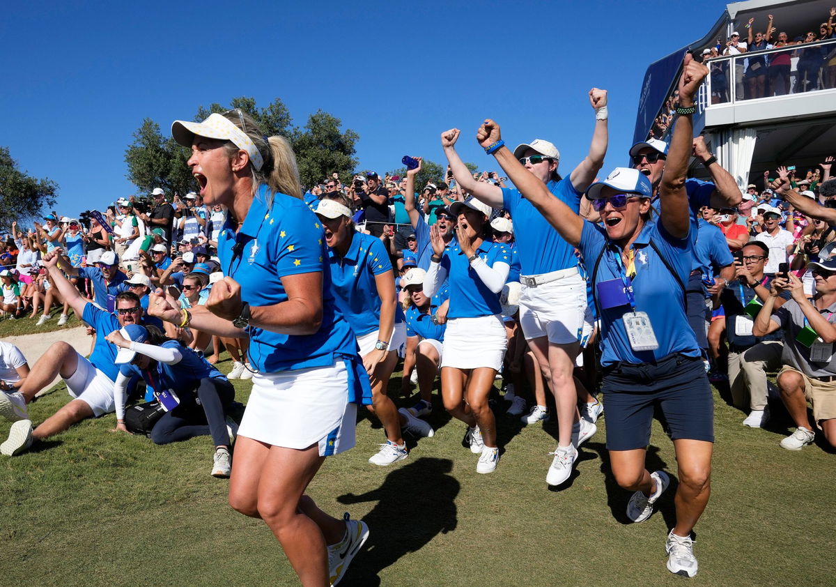 <i>Bernat Armangue/AP</i><br/>The European team celebrates Carlota Ciganda's point-winning putt at the 2023 Solheim Cup in Finca Cortesin