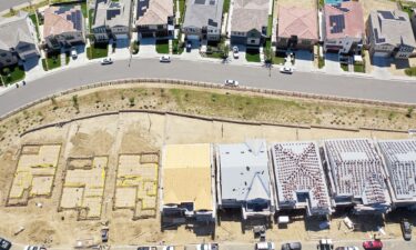 An aerial view of existing homes near new homes under construction (BOTTOM) in the Chatsworth neighborhood on September 8 in Los Angeles