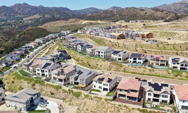 An aerial view of existing homes near new homes under construction (UPPER R) in the Chatsworth neighborhood on September 8 in Los Angeles