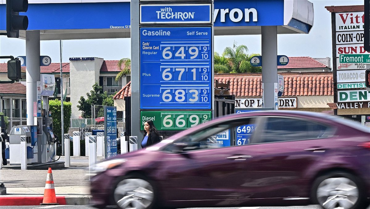 <i>Frederic J. Brown/AFP/Getty Images</i><br/>A sign displays the price of gas at more than 6 USD per gallon