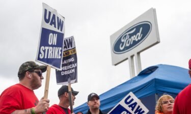 Members of the United Auto Workers (UAW) pickett outside of the Michigan Parts Assembly Plant in Wayne
