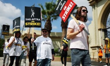 Striking WGA (Writers Guild of America) members picket with striking SAG-AFTRA members outside Paramount Studios on September 18 in Los Angeles